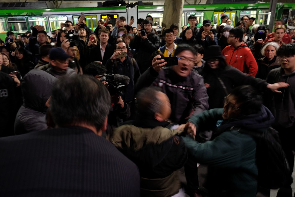 Pro-Hong Kong and pro-Beijing supporters clash at a Melbourne rally. Photo: Edouard Morton