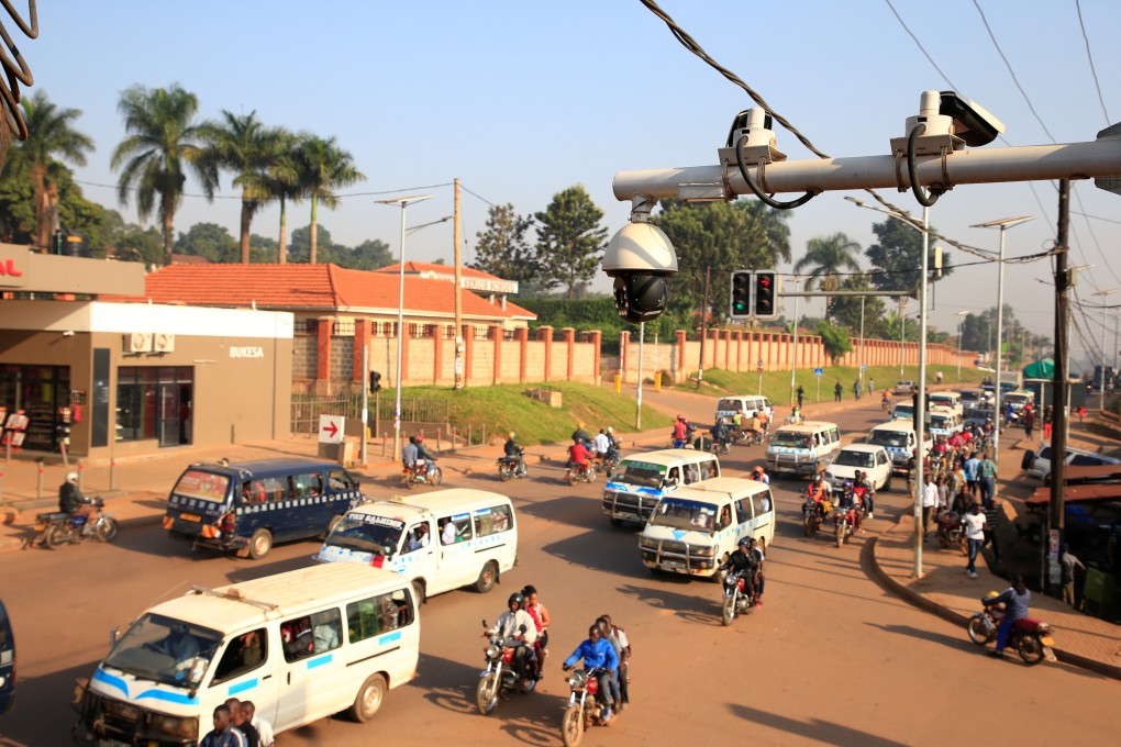 Traffic flows under the surveillance camera system along a street in Kampala, Uganda this week. Photo: Reuters