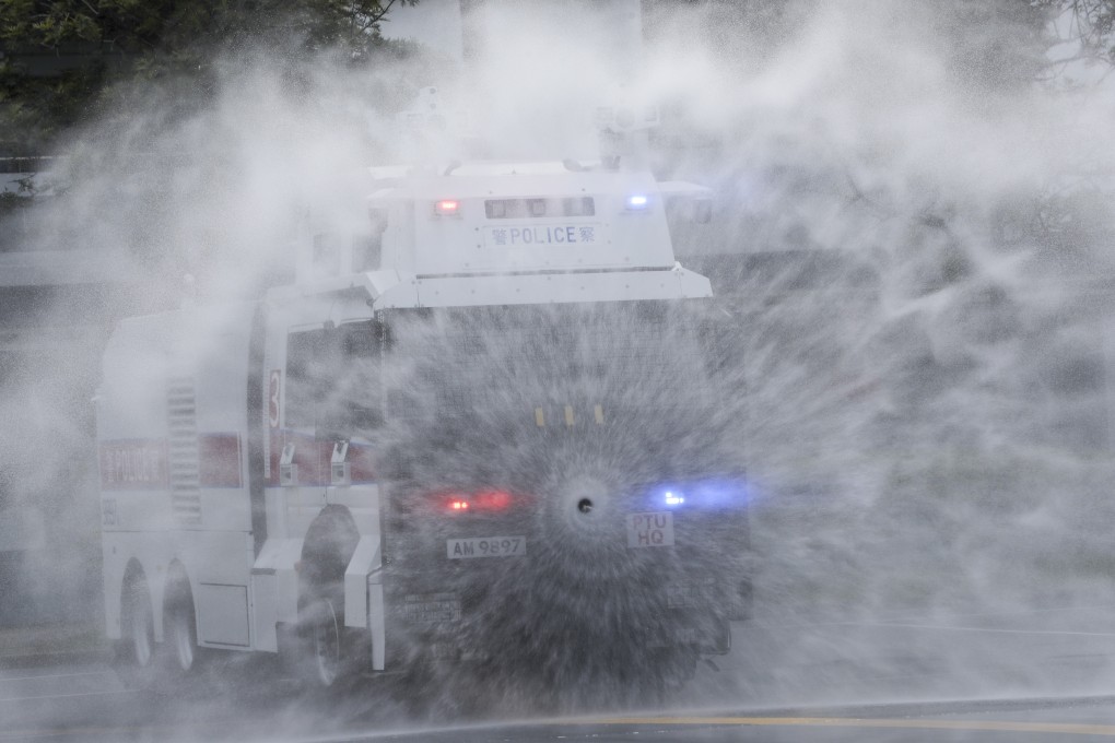 Police demonstrate a water cannon at the Police Tactical Unit compound in Fanling on Monday. Photo: Sam Tsang