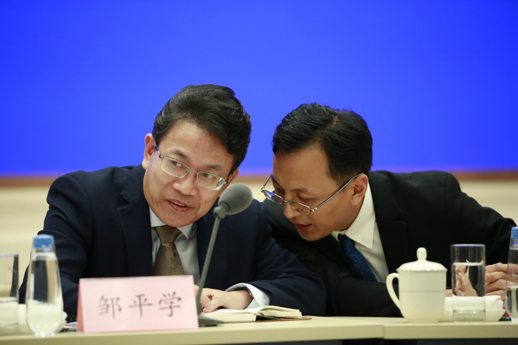 Shenzhen University law professor Zou Pingxue (left) and Zhang Jian, director of Hong Kong and Macau Studies at the Shanghai Institutes of International Studies, offer their assessment of Hong Kong’s crisis in Beijing on Thursday. Photo: EPA-EFE