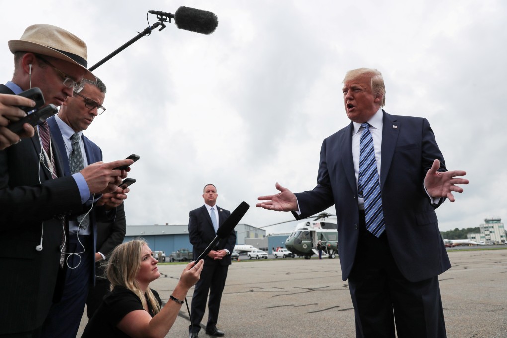 US President Donald Trump talks to reporters as he boards Air Force One on Tuesday. Photo: Reuters