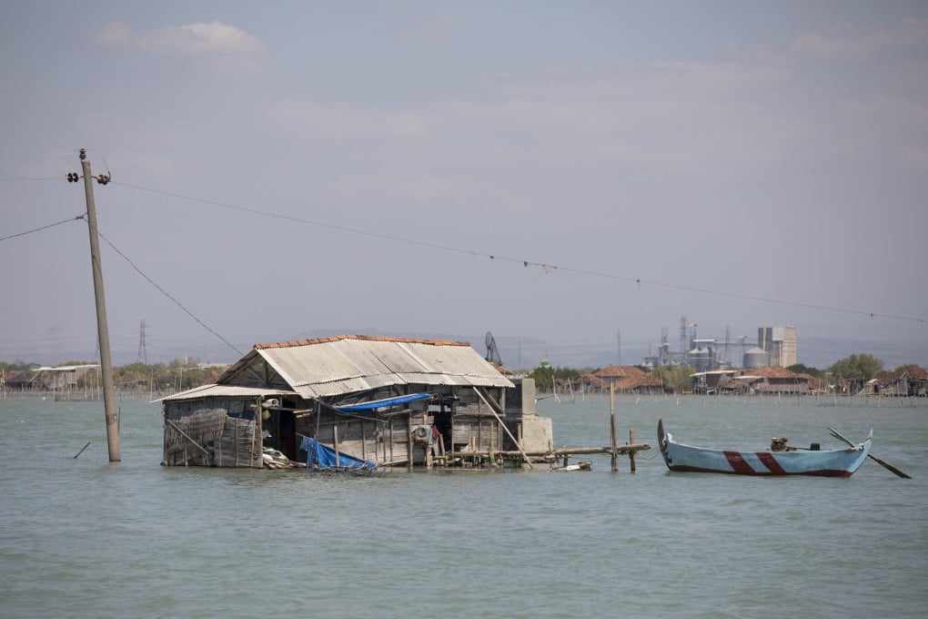 A semi-submerged house close to the village of Bedono, on Java island, in Indonesia. The area has become an eco-tourism destination highlighting the dangers of coastal erosion and rising sea levels. Photo: Antony Dickson