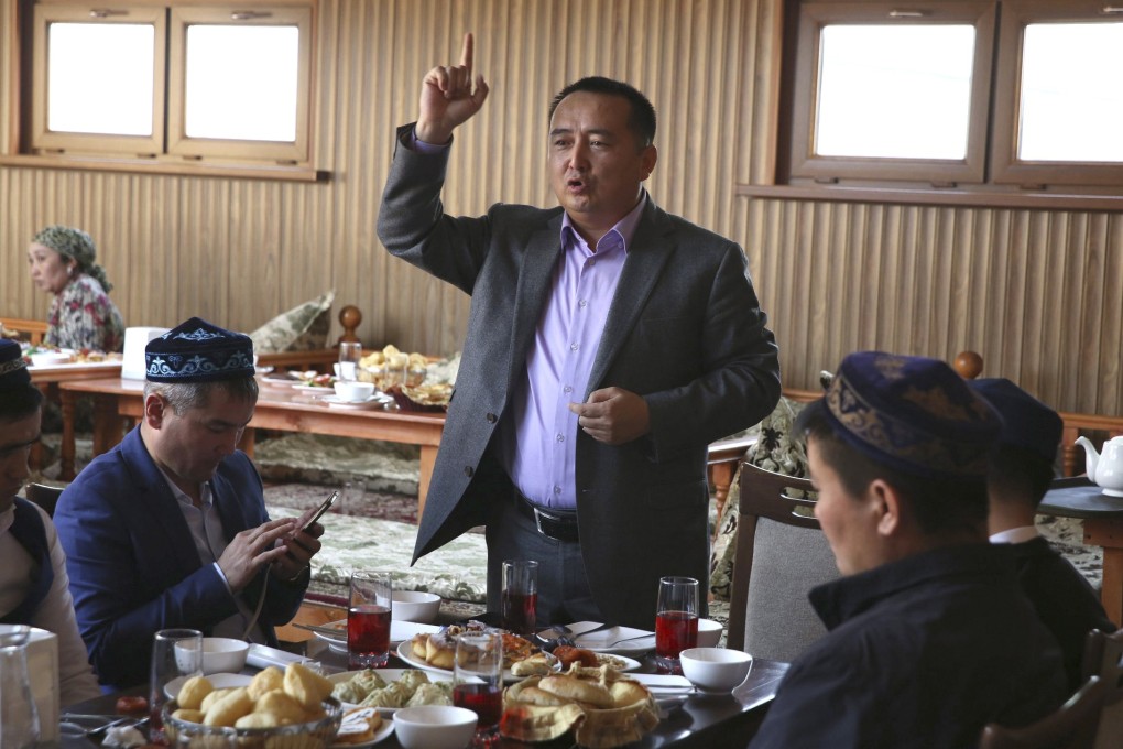 Activist Serikjan Bilash speaks to a crowd of Kazakhs at a restaurant in Almaty, Kazakhstan in March 2018. Photo: AP