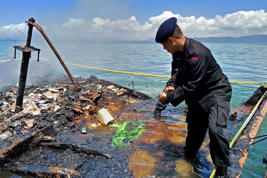 The charred remains of a ferry that caught fire in Indonesia. Photo: AFP