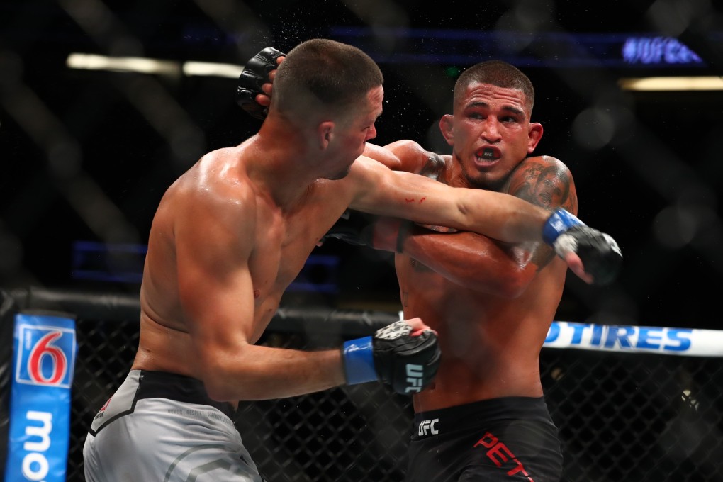 Nate Diaz throws a punch against Anthony Pettis. Photo: AFP