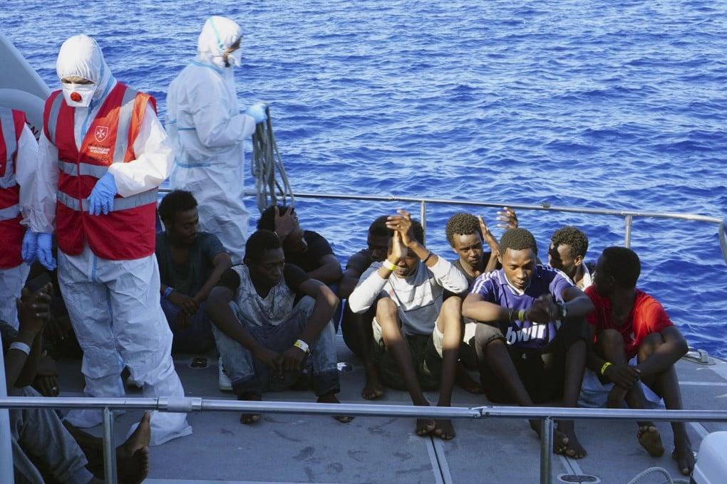 Migrants are evacuated from the Open Arms Spanish humanitarian boat. Photo: AP Photo