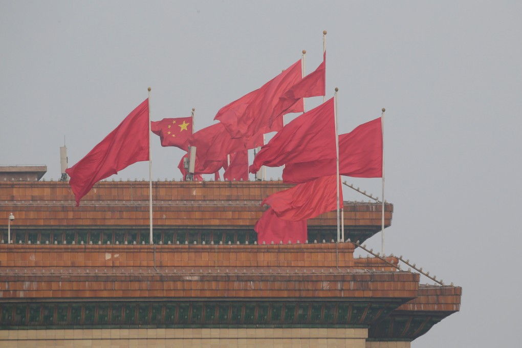 Red flags flutter on the top of the Great Hall of the People in Beijing. Photo: Reuters