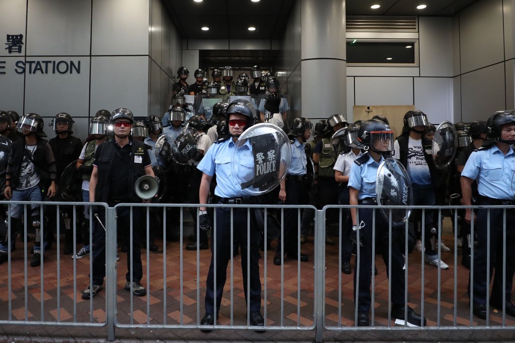 In the Facebook video, police were seen trying to dissuade anti-government protesters from breaking the law. Photo: Sam Tsang