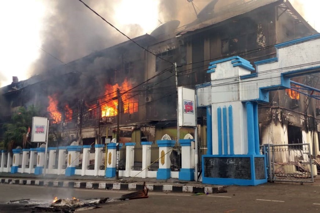A local parliament building burns during a protest in Manokwari, West Papua. Photo: EPA-EFE