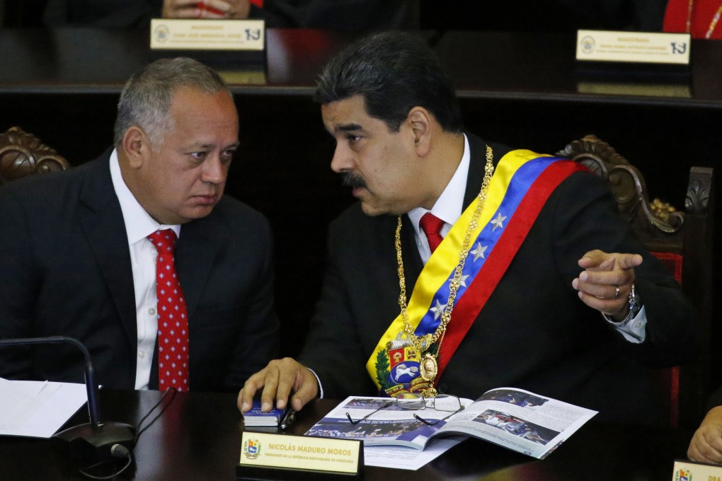 Venezuelan President Nicolas Maduro (right) speaks with United Socialist Party of Venezuela Vice-President Diosdado Cabello in January. Photo: AP