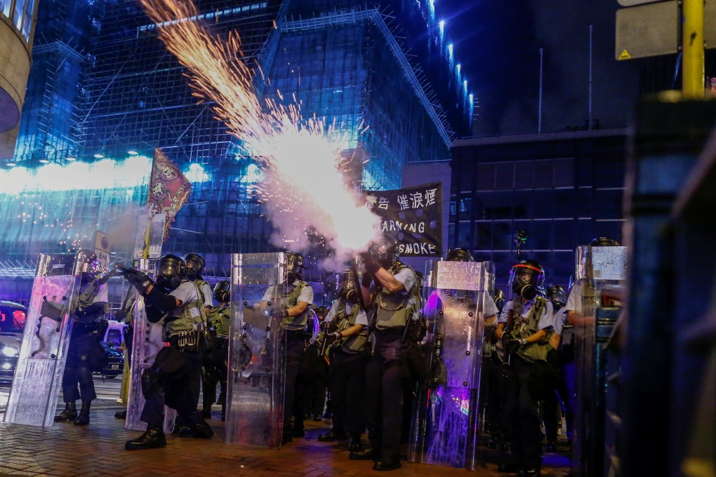 Police fire tear gas at protesters in Hong Kong this month. Antagonism and conflict is also playing out online between demonstrators and mainland Chinese. Photo: Reuters