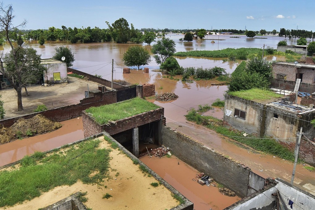 Floods seen at Allowal village in Ludhiana, India, after water was released from the Ropar Headworks in Sutlej River. Photo: EPA-EFE