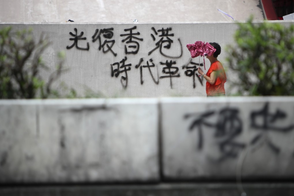 The protesters’ rallying cry of “Liberate Hong Kong; revolution of our times” is seen on August 6 spray-painted on a wall in Mong Kok. Photo: Winson Wong