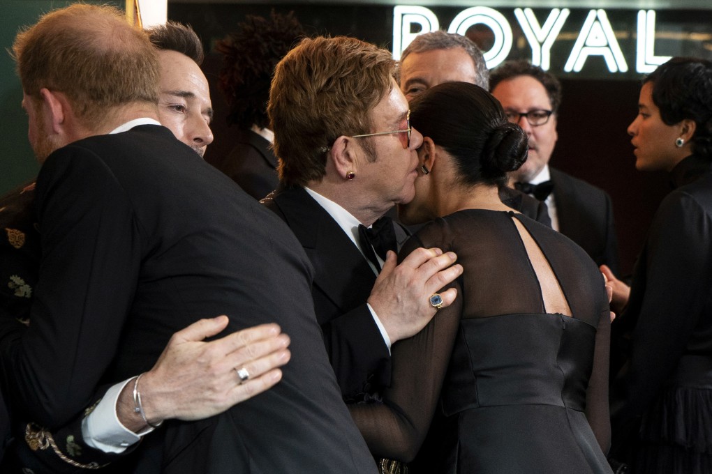 Britain's Prince Harry, Duke of Sussex, greets Canadian producer David Furnish as British singer-songwriter Elton John speaks with Britain's Meghan, Duchess of Sussex. Photo: Reuters