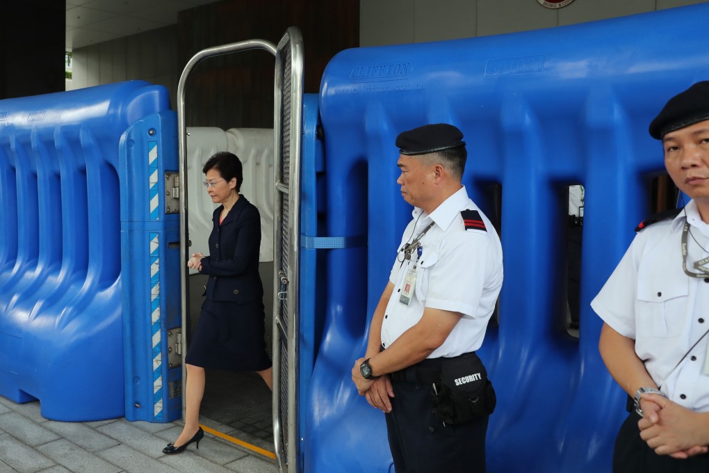 Carrie Lam, here stepping out to meet the press at the Central Government Offices on Tuesday, must explore ways to break the deadlock, including proactively considering withdrawing the bill and initiating an independent inquiry into alleged police misconduct. Photo: Sam Tsang
