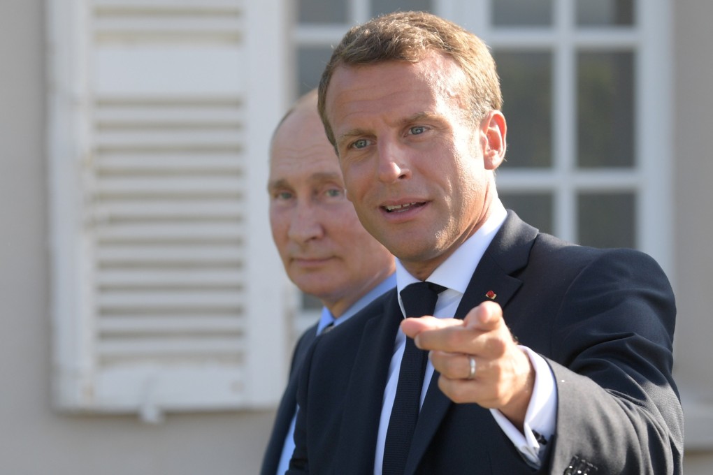 French President Emmanuel Macron (right) meets Russian President Vladimir Putin near the village of Bormes-les-Mimosas in France on Monday. Photo: Sputnik via Reuters