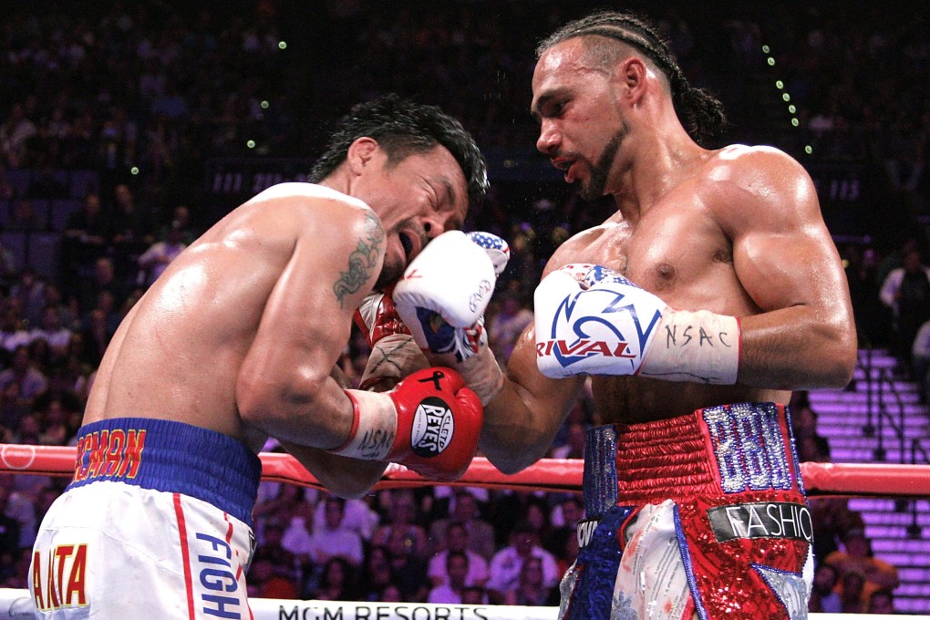 Keith Thurman slams a right hand to the face of Manny Pacquiao. Photo: AFP
