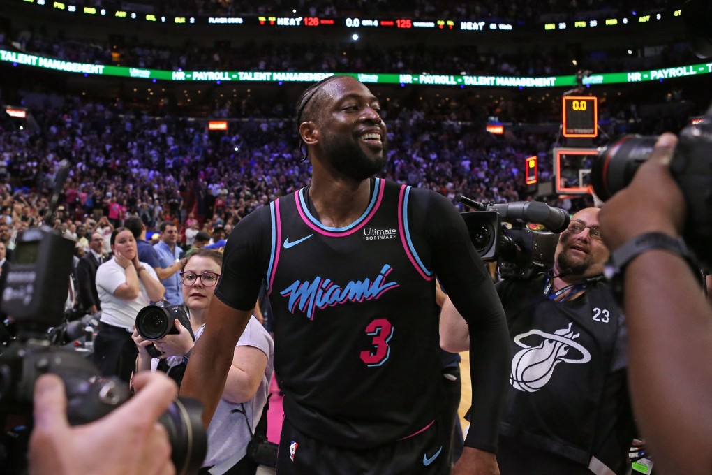 The Miami Heat's Dwyane Wade celebrates a win over the Golden State Warriors during his farewell season. Photo: TNS