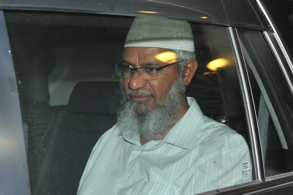 Preacher Zakir Naik arrives at police headquarters for questioning in Kuala Lumpur on Friday. Photo: AP