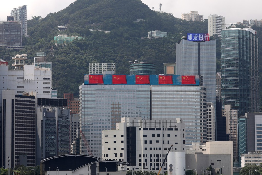 The Chinese national flag is displayed on a Hong Kong building in a show of support for the government, as seen from Tsim Sha Tsui on August 12. Photo: Nora Tam