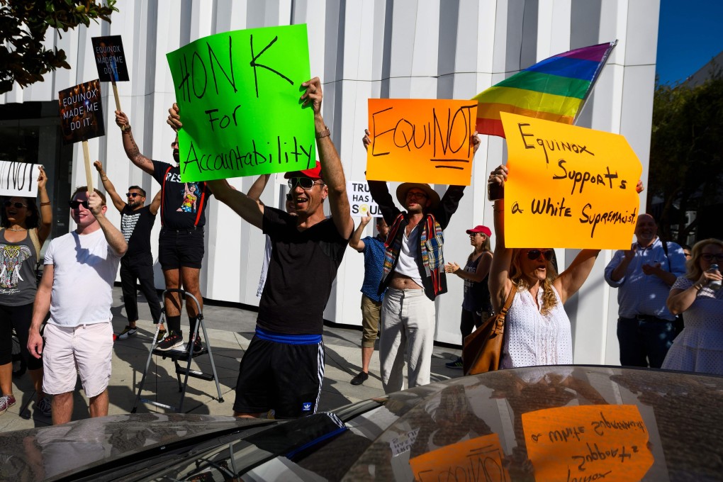 Protesters chant slogans and hold signs outside the luxury gym Equinox in West Hollywood, California, during a protest against the gym and fitness company SoulCycle, US President Donald Trump and his benefactor Stephen Ross, owner of Equinox and SoulCycle. Photo: AFP