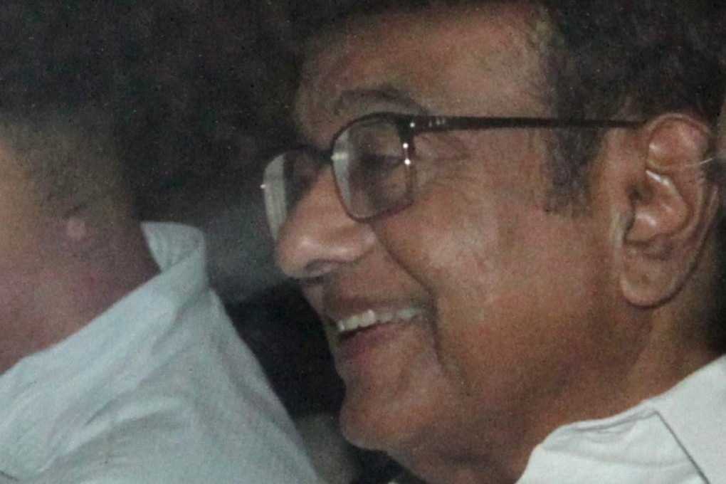 India's former finance minister Palaniappan Chidambaram sits in a vehicle after he was arrested at his residence in New Delhi. Photo: Reuters