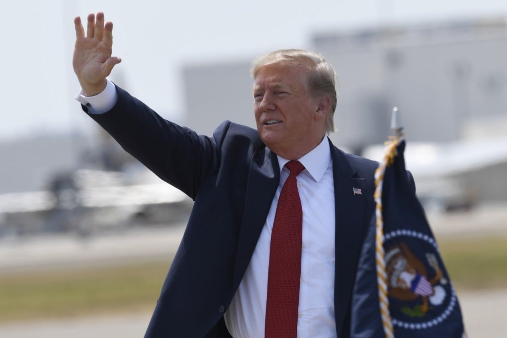 US President Donald Trump waves to the crowd after arriving at Louisville International Airport in Kentucky on Wednesday. Photo: AP