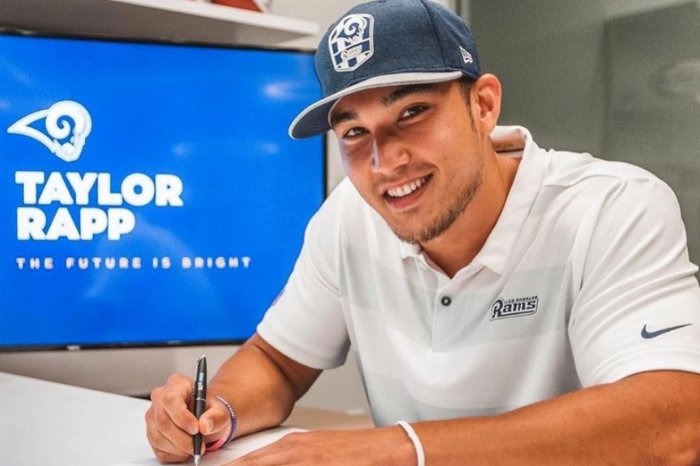 Taylor Rapp signs for the Los Angeles Rams of the NFL. Photo: Instagram/Taylor Rapp