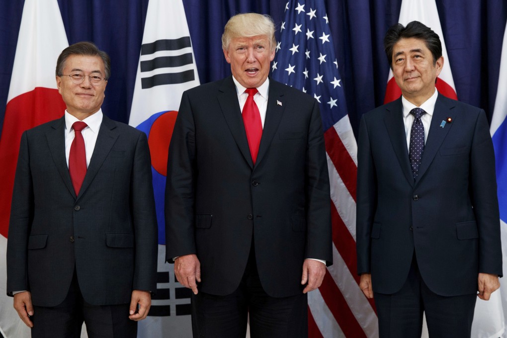 Donald Trump pictured with South Korean President Moon Jae-in (left) and Japanese Prime Minister Shinzo Abe (right) in 2017. Photo: AP