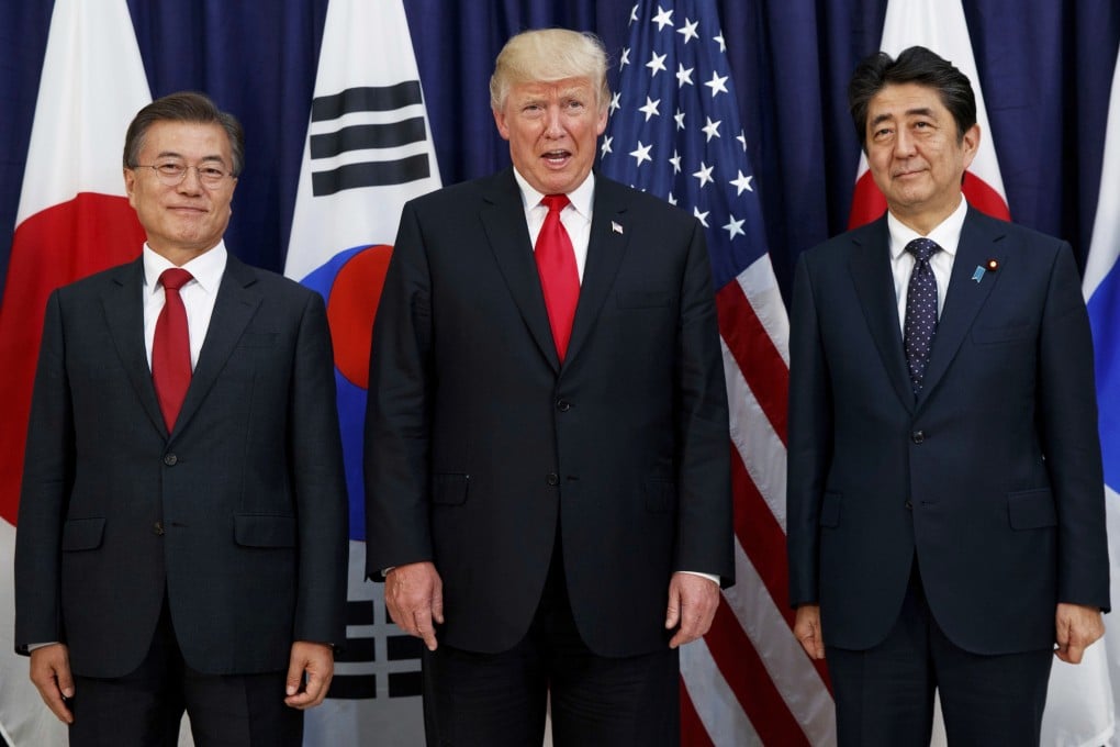 Donald Trump pictured with South Korean President Moon Jae-in (left) and Japanese Prime Minister Shinzo Abe (right) in 2017. Photo: AP