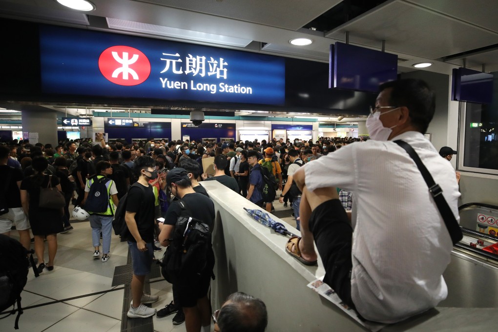 Anti-government protesters stage a sit-in at Yuen Long MTR station on Wednesday night, one month after the attack on protesters and commuters. Photo: Winson Wong