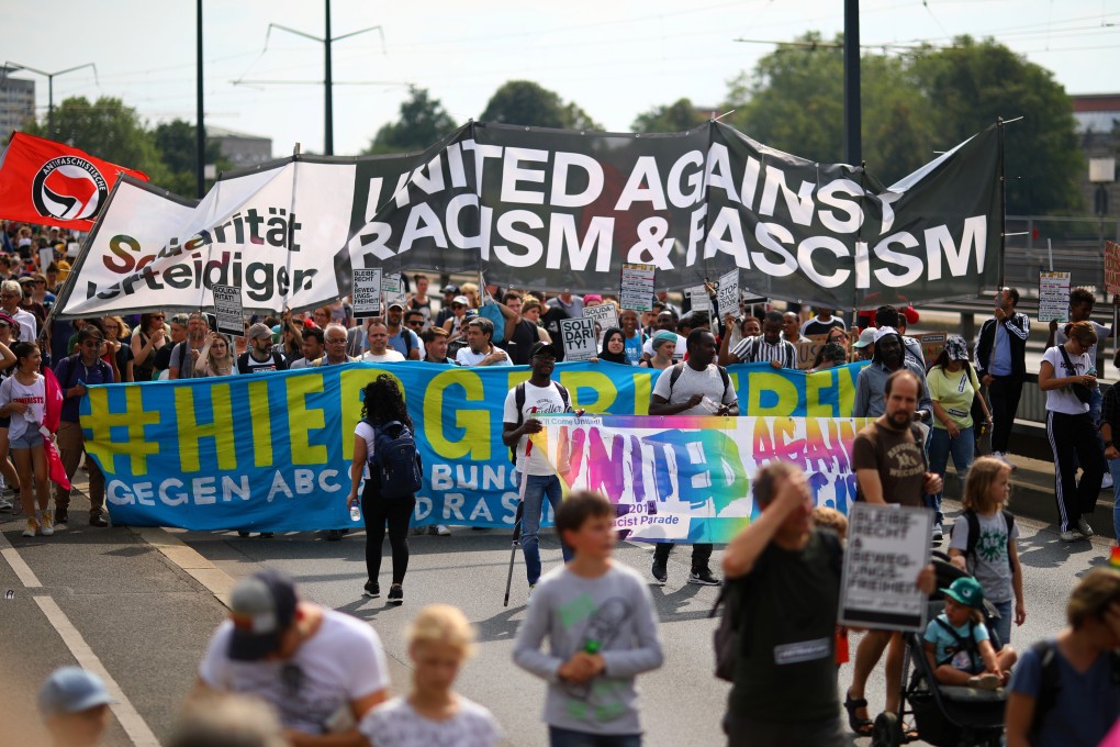 People attend a rally with the slogan #unteilbar (indivisible) in Dresden, Germany. Photo: Reuters