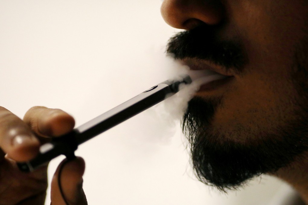A man smokes an e-cigarette at a cafe in Dubai on Thursday. Photo: Reuters