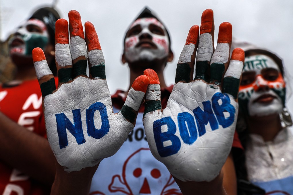 An Indian student with peace messages written on his hands takes part in a “Hiroshima Day” peace rally in Mumbai. Photo: EPA-EFE