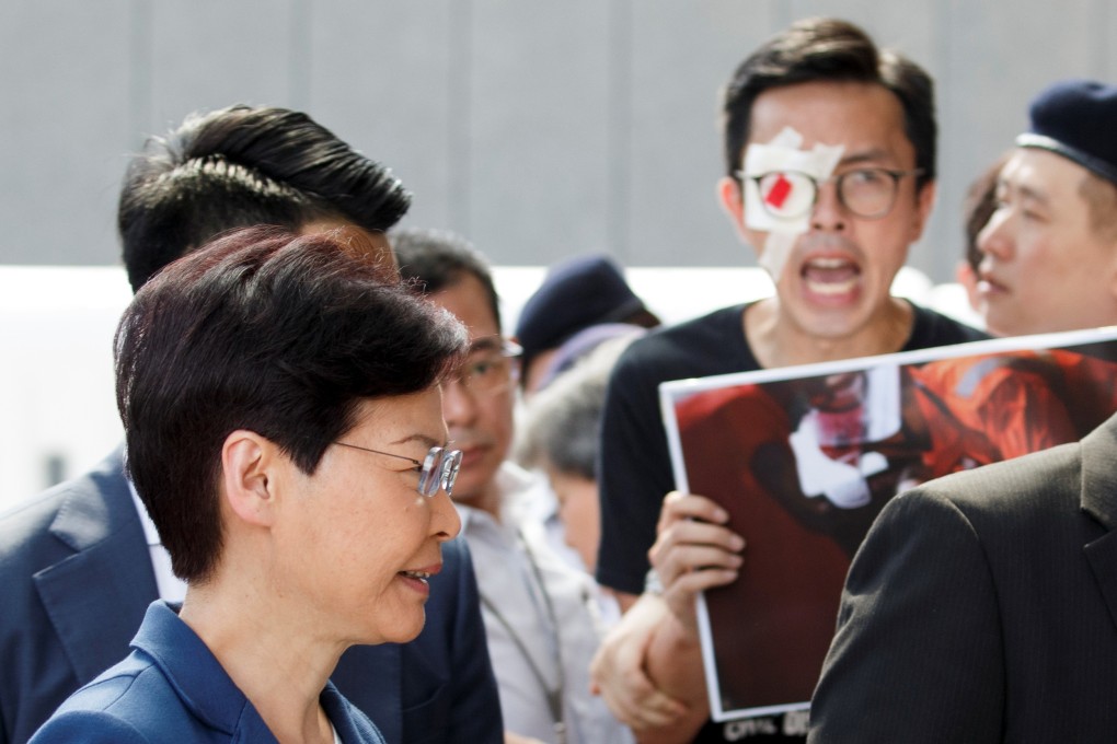 Hong Kong Chief Executive Carrie Lam meets petitioners outside her office in Hong Kong on August 13. Photo: Reuters