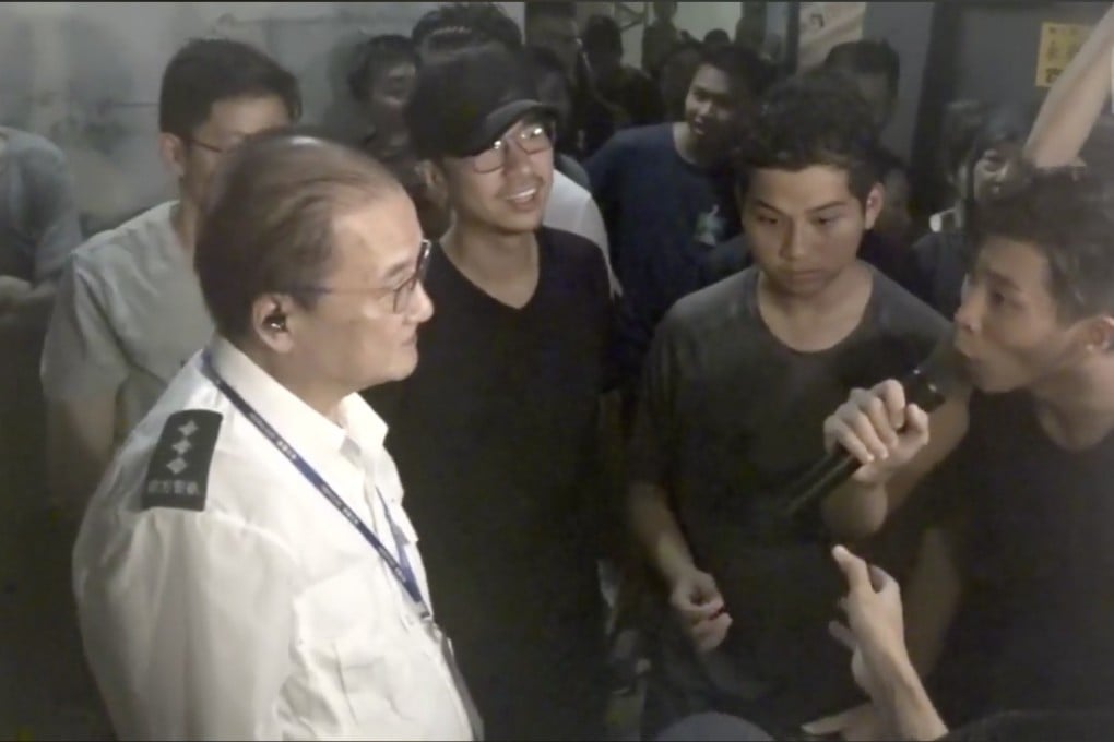 Residents argue with security guards over access to Richland Gardens in Kowloon Bay, with some protesters complaining they were not allowed to return home. Photo: RTHK