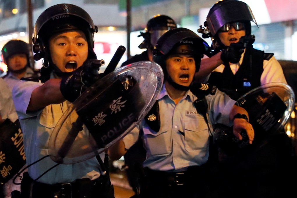 Police officers who drew their guns in Tsuen Wan on Sunday showed extraordinary restraint and professionalism. But the whole incident could have had a much worse outcome. Photo: Reuters