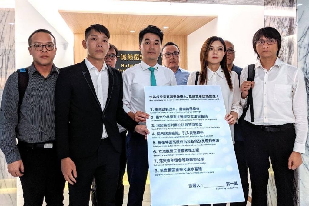 Members of the New Macau Association hold a list of demands for the new government to enact after meeting with Ho Iat-seng, the then-candidate for chief executive, on August 13. Photo: Facebook / New Macau Association