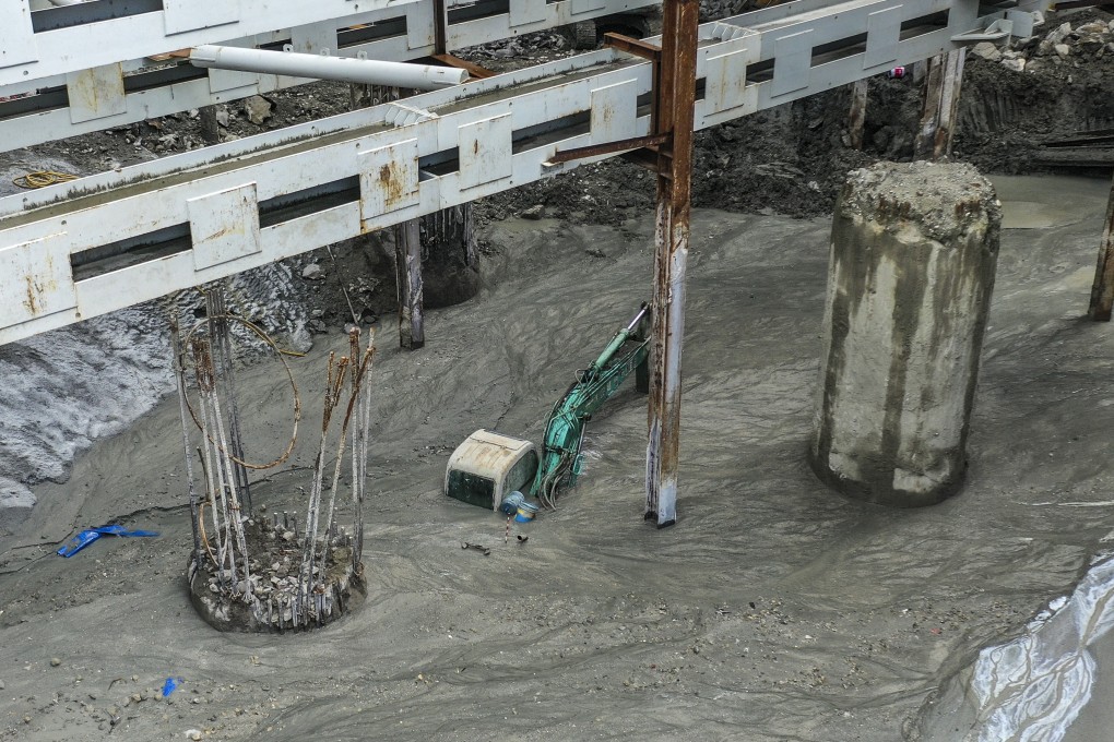 An excavator submerged by flooding on July 25 at the construction site for the Lyric Theatre at the West Kowloon Cultural District. Photo: Winson Wong