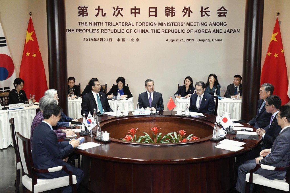 The foreign ministers of China, Japan and South Korea gathered for trilateral talks in Beijing on Wednesday. Photo: Kyodo