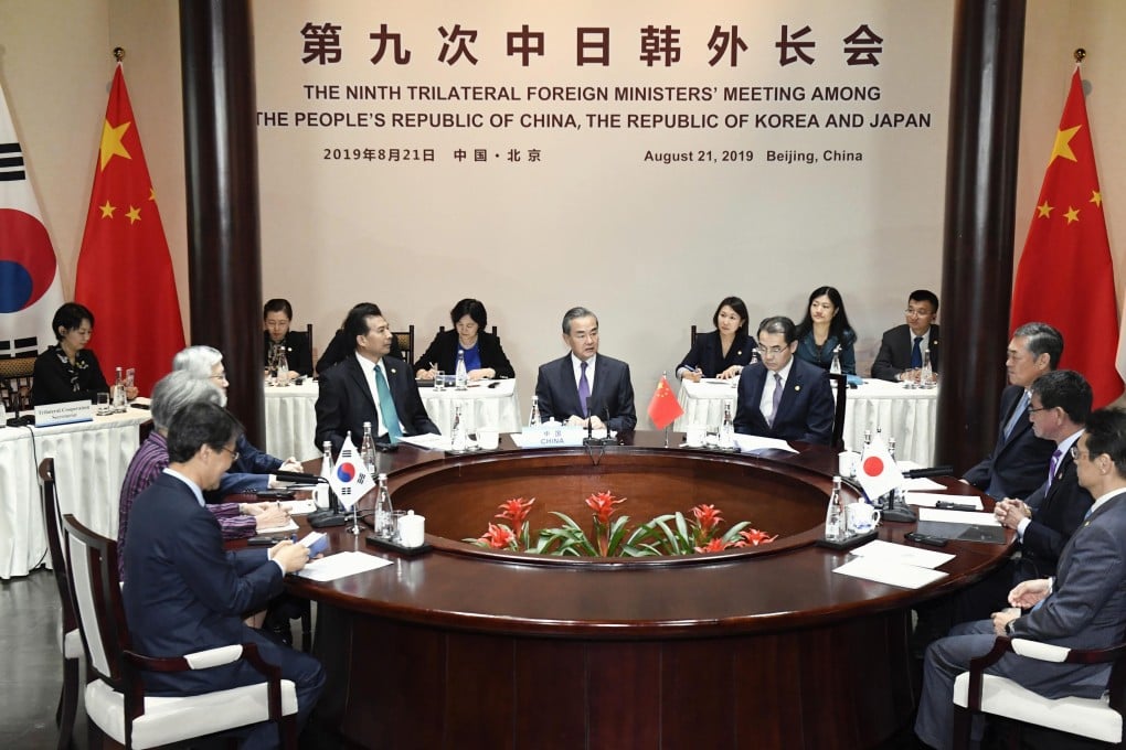 The foreign ministers of China, Japan and South Korea gathered for trilateral talks in Beijing on Wednesday. Photo: Kyodo