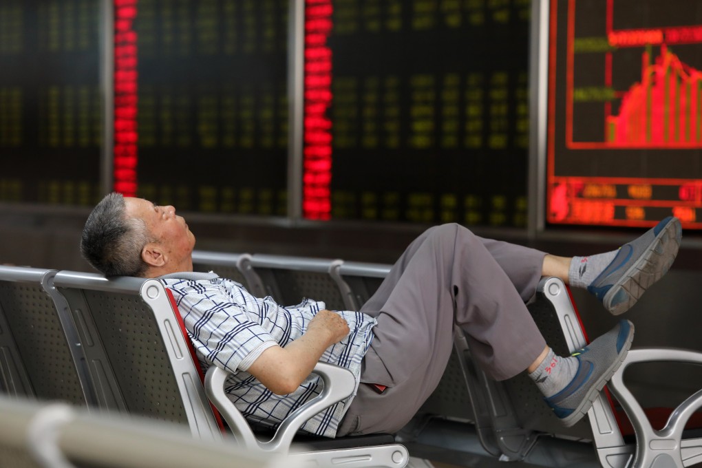 Stock trader takes a break at a brokerage house in Beijing on August 6, 2019. Photo: Simon Song