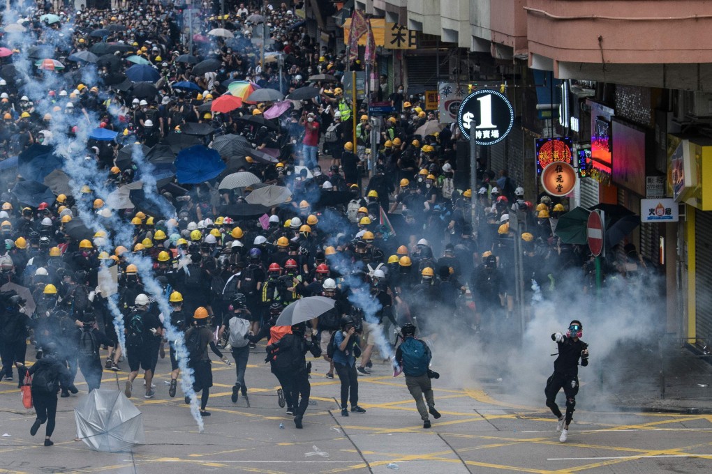 Tear gas is fired by police at protesters in Sham Shui Po in Hong Kong on August 11, 2019. Photo: AFP
