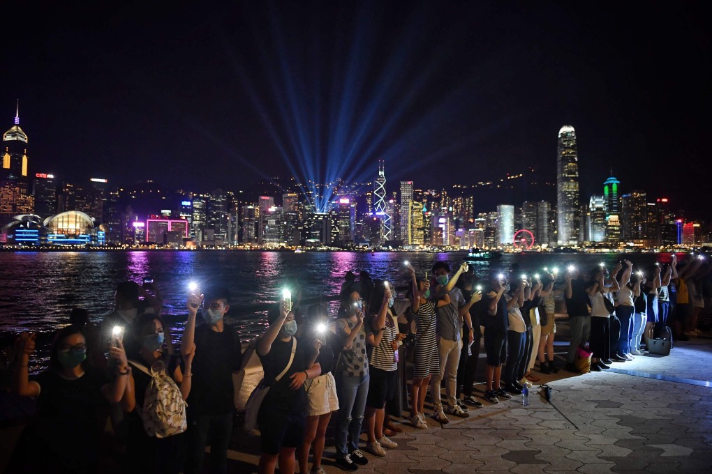 Protesters form a human chain as part of the “Hong Kong Way” demonstrations along Victoria Harbour on August 23, coinciding with the 30th anniversary of the Baltic Way demonstrations in 1989. Photo: AFP