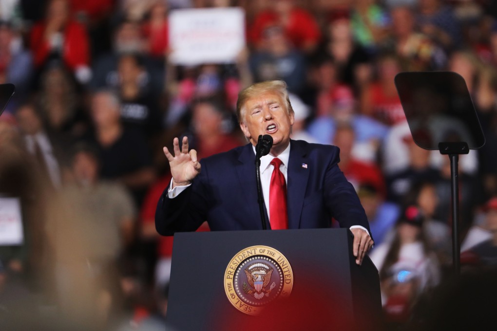 President Donald Trump speaks to supporters at a rally in Manchester. Photo: AFP