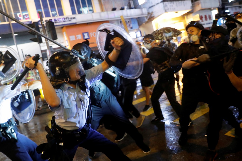 Police and protesters clash during a night of violence in Tsuen Wan, Hong Kong on Sunday night. Photo: Reuters