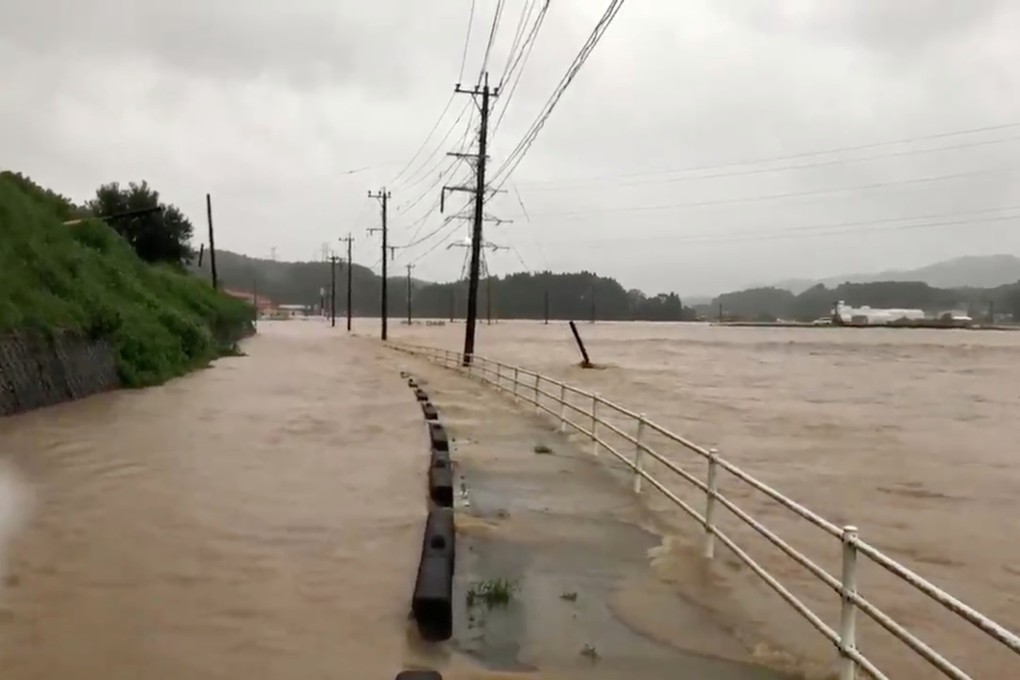The Matsuura River is seen overflowing in Saga prefecture on Wednesday. Photo: Reuters