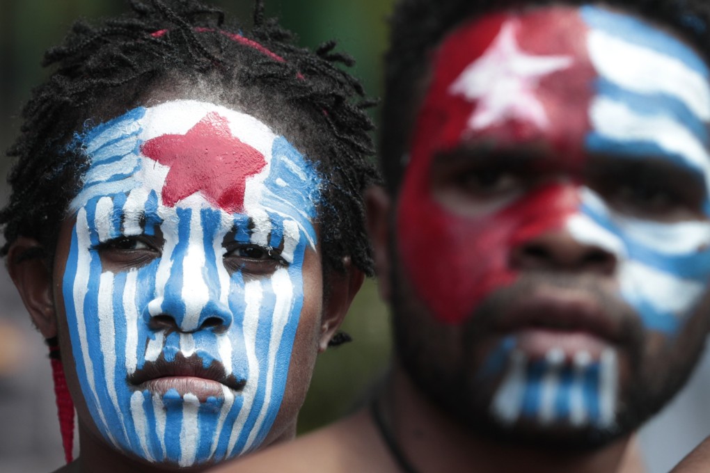 Papuan activists with their faces painted with the colours of the separatist Morning Star flag. Photo: AP