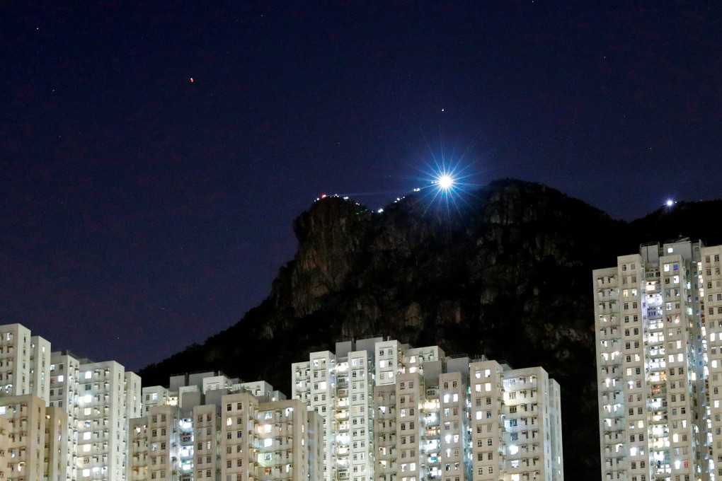 The ridge of Lion Rock, seen from Wong Tai Sin, is illuminated by protesters’ smartphones on August 23. Photo: Reuters