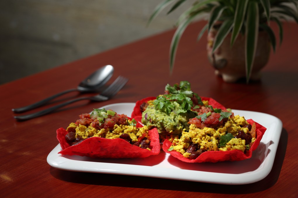 Mexican vegan tacos made with kidney beans, vegan egg, guacamole and salsa at Confusion Plant Based Kitchen.